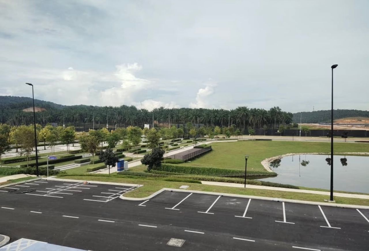 Landscaped green space and water feature viewed from the development