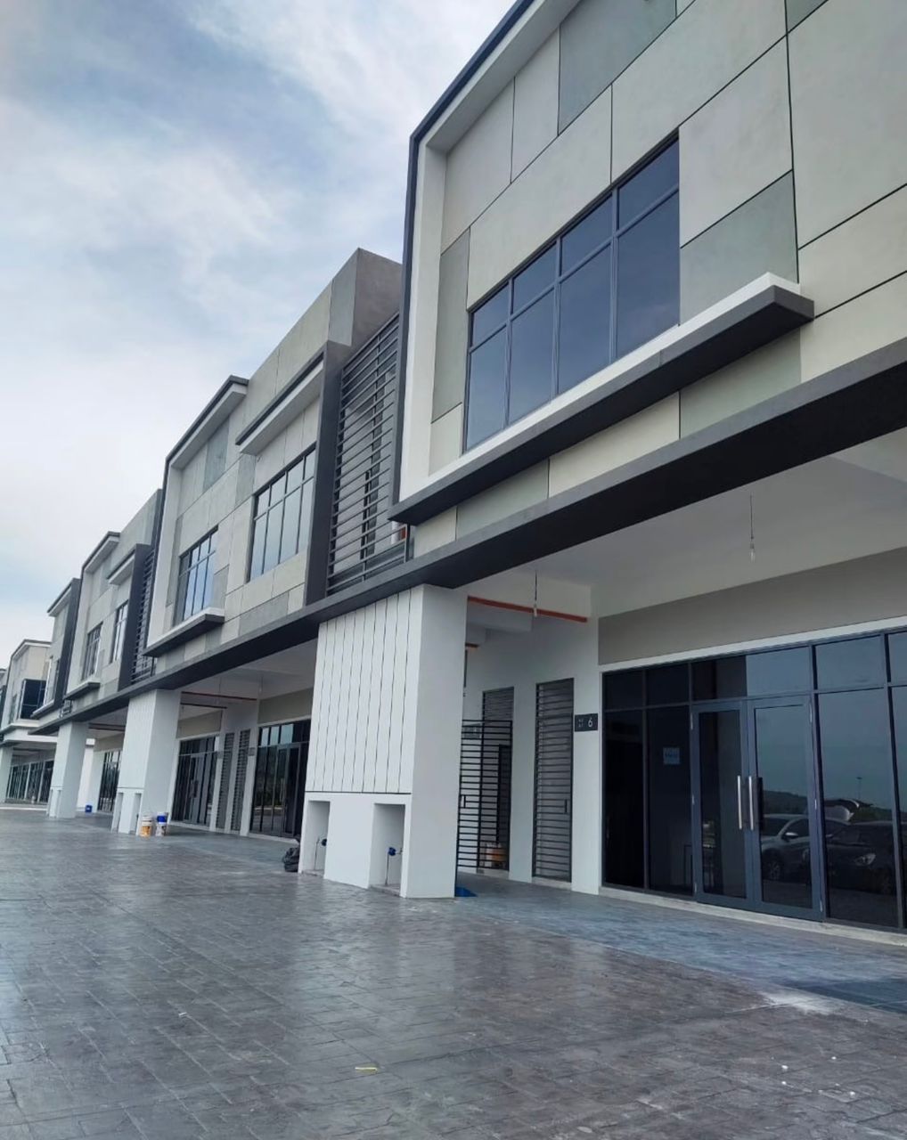 Actual frontage and neighbouring factory row